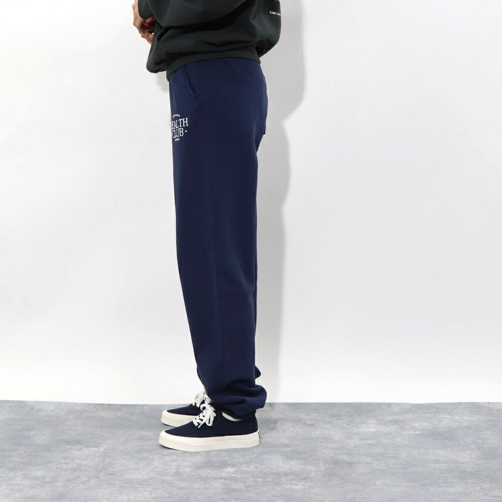 スポーティー&リッチ Sporty&Rich ボトムス ロングパンツ ユニセックス ネイビー コットン 裏起毛 メンズ レディース ロゴプリント スウェットパンツ SRB1PT206