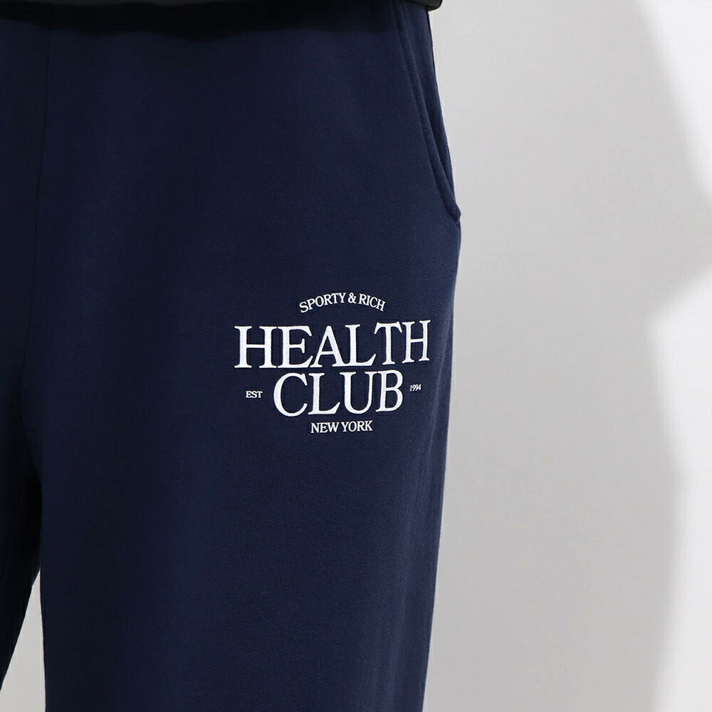 スポーティー&リッチ Sporty&Rich ボトムス ロングパンツ ユニセックス ネイビー コットン 裏起毛 メンズ レディース ロゴプリント スウェットパンツ SRB1PT206