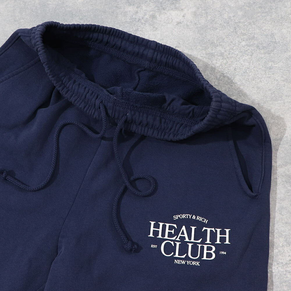 スポーティー&リッチ Sporty&Rich ボトムス ロングパンツ ユニセックス ネイビー コットン 裏起毛 メンズ レディース ロゴプリント スウェットパンツ SRB1PT206