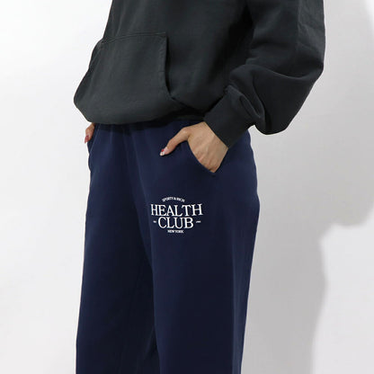 スポーティー＆リッチ Sporty＆Rich ボトムス ロングパンツ ユニセックス ネイビー コットン 裏起毛 メンズ レディース ロゴプリント スウェットパンツ SRB1PT206