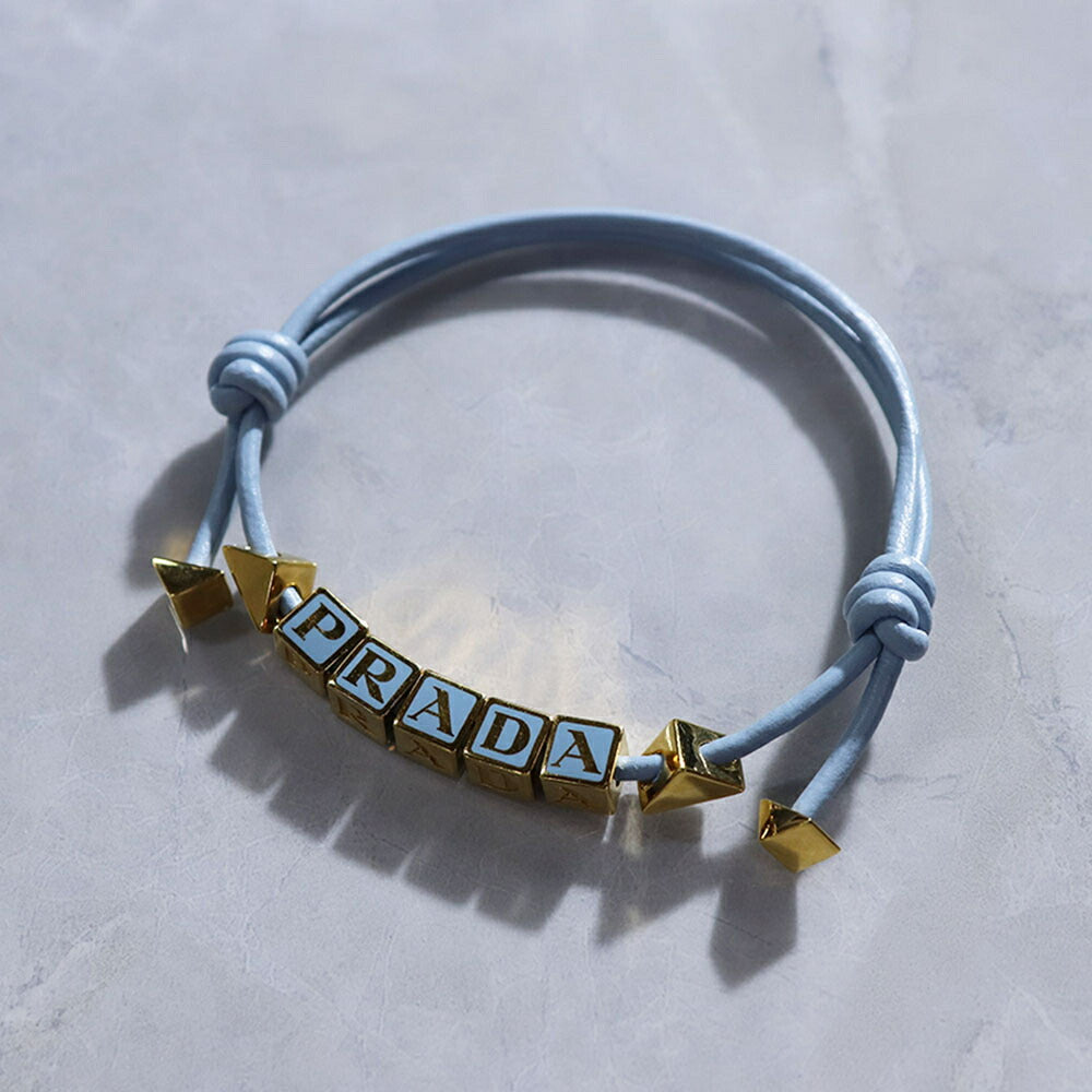 PRADA ブレスレット ブラック ホワイト ライトブルー ライトピンク ロゴ エナメルメタル 1IB522 038
